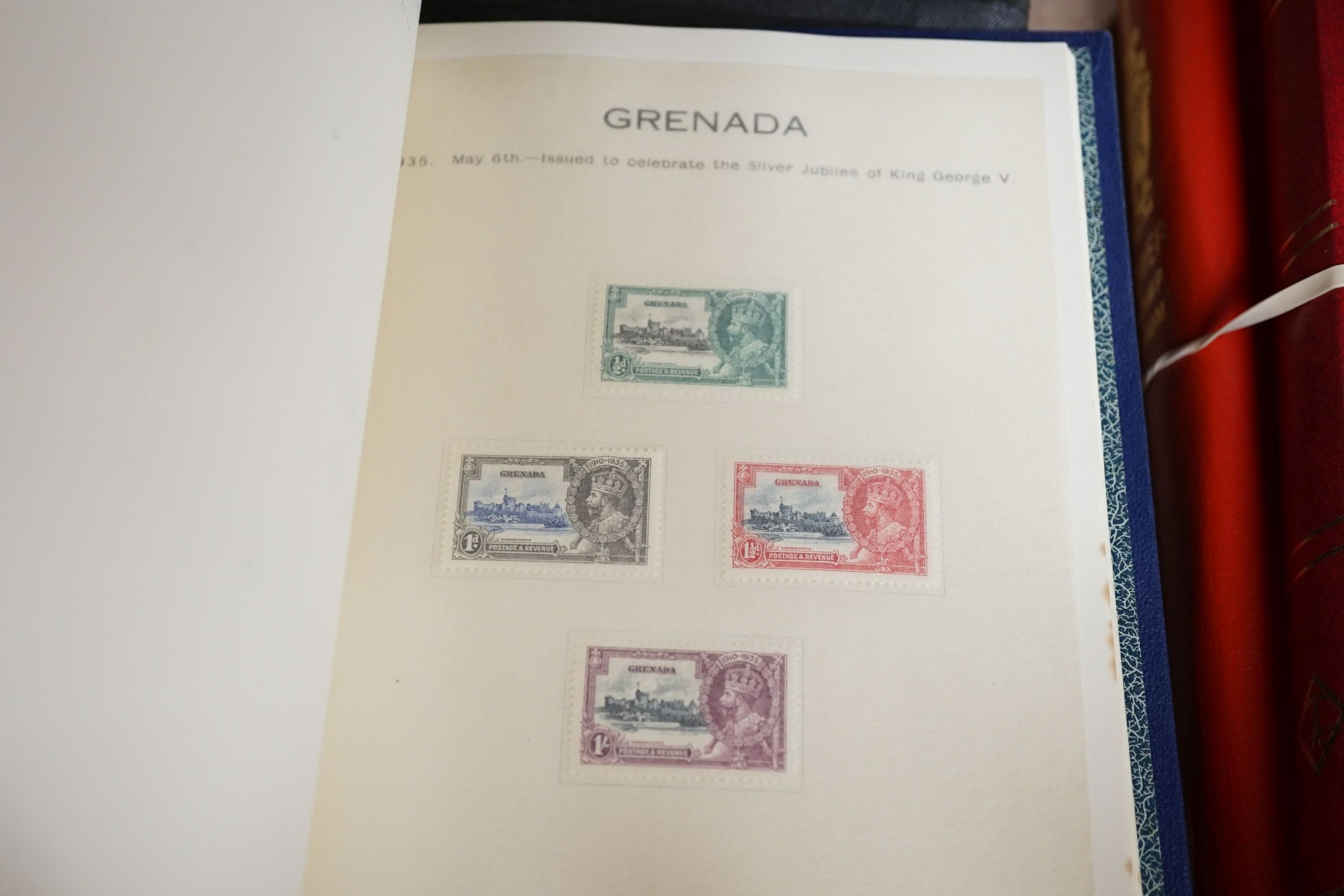 Three stamp albums with 1935 Silver Jubilee mint set of 250 including Egypt, 1937 Coronation two mint sets plus some used